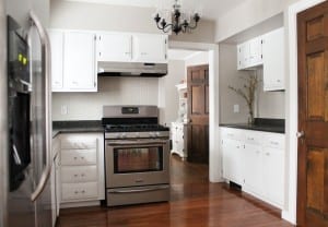 by reusing items and waiting patiently, this kitchen only cost $2500 to renovate. WOW!
