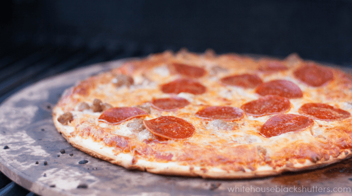 how to grill a frozen pizza, perfect for summer so you don't heat up the house!