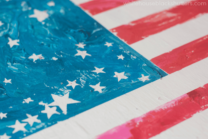 make a flag with painters tape, paint, and stickers! great project for kids