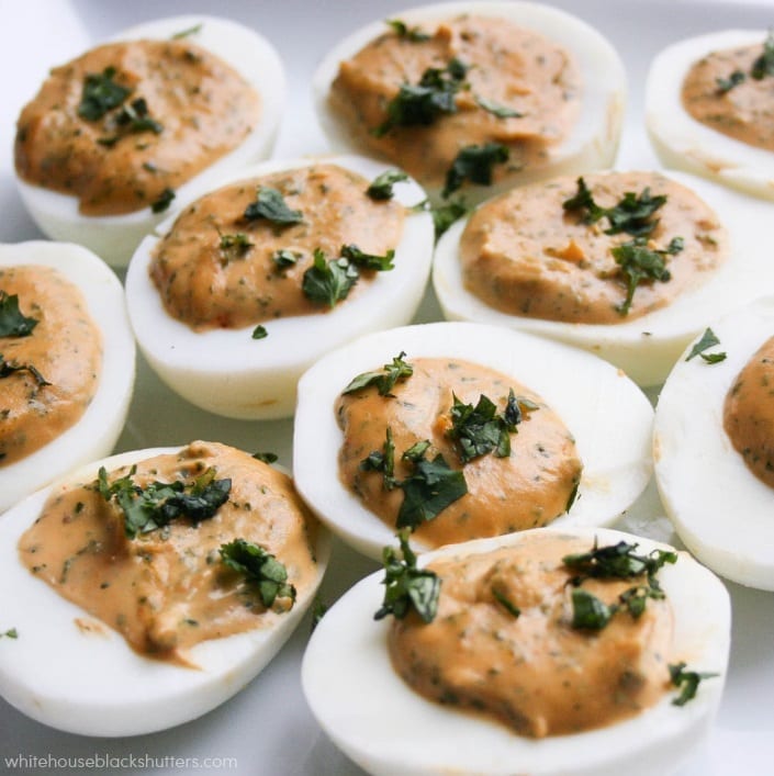 Sriracha Deviled Eggs? Oh my YUM! add sriracha to deviled eggs for a twist on the favorite appetizer.