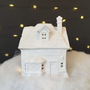 update a dollar store Christmas village with paint and glitter spray!