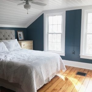 master bedroom makeover with dark walls and planked ceiling